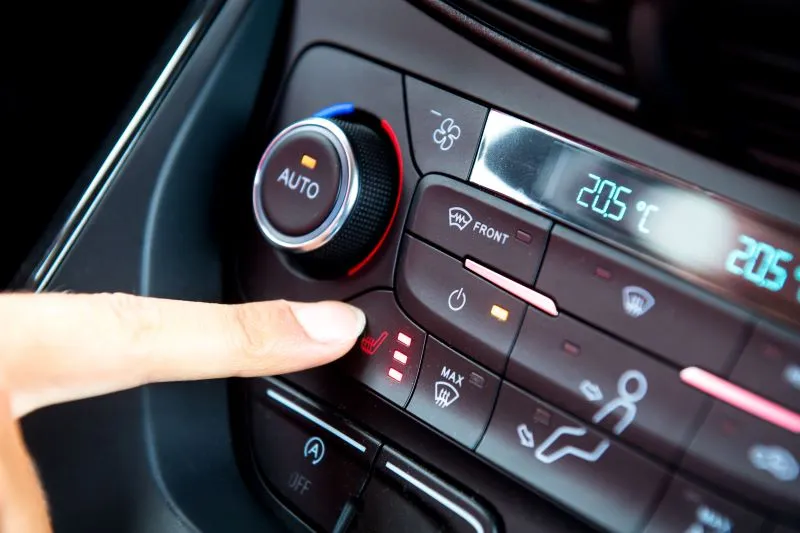 car interior with cold air from vents and low temperature gauge due to stuck open thermostat