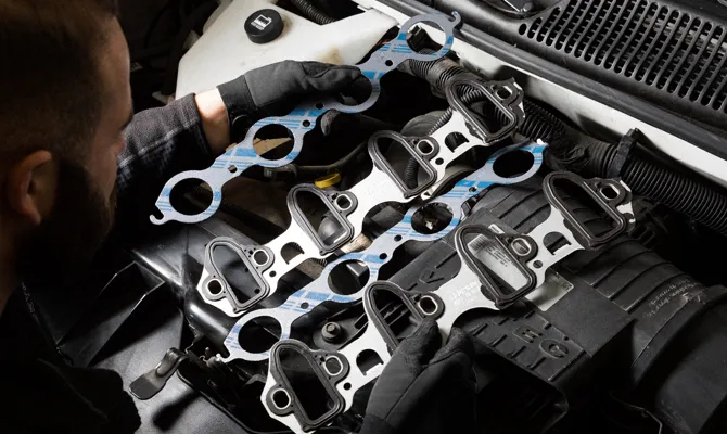 exhaust manifold gasket placement between the cylinder head and exhaust manifold