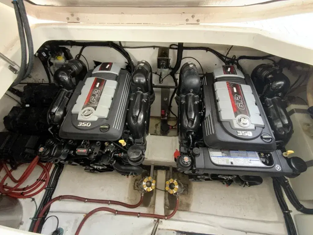 mercruiser 57l marine engine with exhaust manifold and risers in a boat